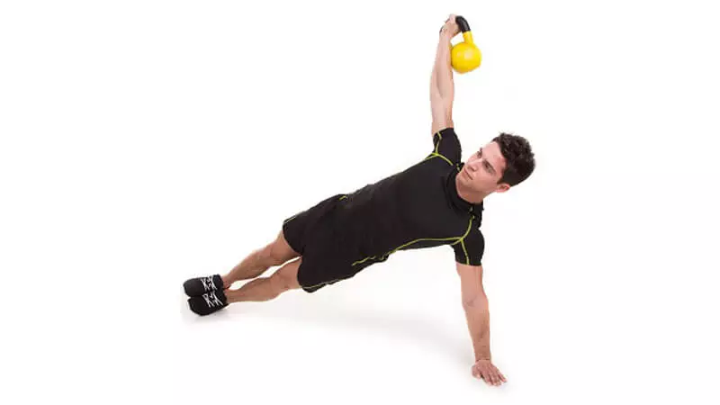 Side plank with kettlebell.